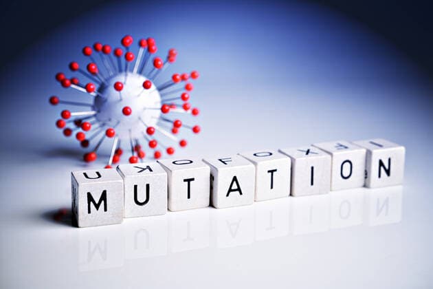 Letter cubes form the word mutation next to a coronavirus model ** NUR FUER REDAKTIONELLE ZWECKE ** EDITORIAL USE ONLY **