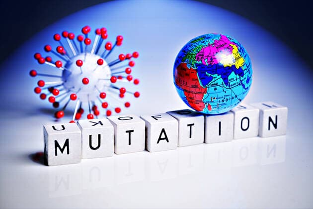 Letter cubes form the word mutation next to a coronavirus model ** NUR FUER REDAKTIONELLE ZWECKE ** EDITORIAL USE ONLY **
