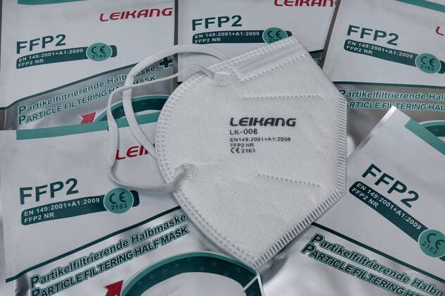 FFP2 masks FFP2 masks, 14 01 2021, Borkwalde, Brandenburg, A FFP2 mask lies on packed masks