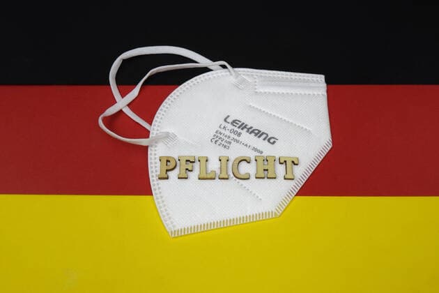 Germany flag with FFP2 mask and duty Germany flag with FFP2 mask and duty, 14 01 2021, Borkwalde, Brandenburg, On a Germany flag lies a FFP 2 mask with the writing duty
