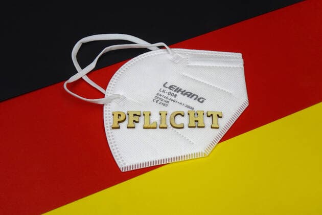 Germany flag with FFP2 mask and duty Germany flag with FFP2 mask and duty, 14 01 2021, Borkwalde, Brandenburg, On a Germany flag lies a FFP 2 mask with the writing duty