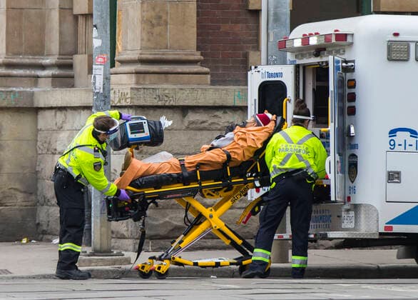 (210114) -- TORONTO, Jan. 14, 2021 -- A patient is wheeled into an ambulance in Toronto, Ontario, Canada, on Jan. 14, 2021. Ontario s stay-at-home order went into effect on Thursday, requiring residents to stay home except for essential outings. (Photo by Xinhua) CANADA-ONTARIO-COVID-19-STAY-AT-HOME ORDER ZouxZheng 