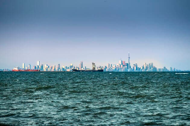 distance view of Toronto skyline with freighters, Ontario, Canada  acp134207 VictorxKorchenko