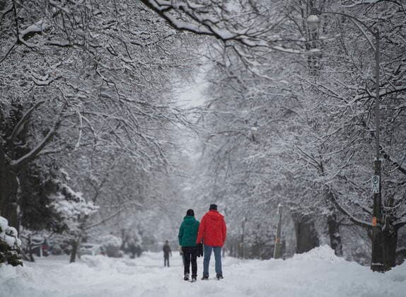January 16, 2021, Ottawa, on, Canada: People walk on the snow-covered street in Ottawa s Glebe neighbourhood during a major snowstorm on Saturday, Jan. 16, 2021. A snowfall warning is in effect with Environment Canada predicting between 15 to 30 cm of snow by tonight. Ottawa Canada  - ZUMAc35_ 20210116_zaf_c35_024 Copyright: xJustinxTangx