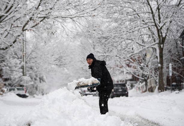 January 16, 2021, Ottawa, on, Canada: Benoit Leduc shovels his driveway during a major snowstorm in Ottawa on Saturday, Jan. 16, 2021. A snowfall warning is in effect with Environment Canada predicting between 15 to 30 cm of snow by tonight. Ottawa Canada  - ZUMAc35_ 20210116_zaf_c35_028 Copyright: xJustinxTangx