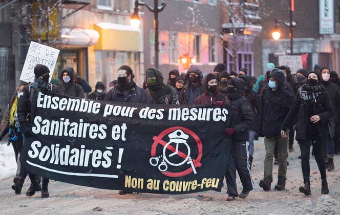 January 16, 2021, Montreal, PQ, Canada: People participate in a demonstration opposing restrictions imposed by the Quebec government to help stop the spread of COVID-19 in Montreal, Saturday, January 16, 2021, as the pandemic continues in Canada and around the world. The Quebec government has imposed a lockdown and a curfew to help curb the spread of COVID-19. The curfew begins at 8 p.m until 5 a.m and lasting until February 8. Montreal Canada  - ZUMAc35_ 20210116_zaf_c35_044 Copyright: xGrahamxHughesx