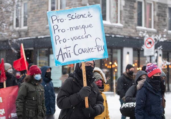 January 16, 2021, Montreal, PQ, Canada: People participate in a demonstration opposing a curfew imposed by the Quebec government to help stop the spread of COVID-19 in Montreal, Saturday, January 16, 2021, as the pandemic continues in Canada and around the world. The curfew begins at 8 p.m until 5 a.m and lasting until February 8. Montreal Canada  - ZUMAc35_ 20210116_zaf_c35_046 Copyright: xGrahamxHughesx