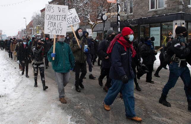 January 16, 2021, Montreal, PQ, Canada: People participate in a demonstration opposing restrictions imposed by the Quebec government to help stop the spread of COVID-19 in Montreal, Saturday, January 16, 2021, as the pandemic continues in Canada and around the world. The Quebec government has imposed a lockdown and a curfew to help curb the spread of COVID-19. The curfew begins at 8 p.m until 5 a.m and lasting until February 8. Montreal Canada  - ZUMAc35_ 20210116_zaf_c35_050 Copyright: xGrahamxHughesx