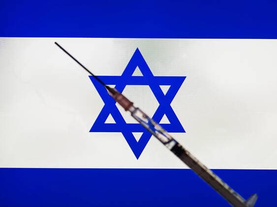 Symbol picture syringe in front of flag as symbol for worldwide vaccination Corona vaccination Worldwide