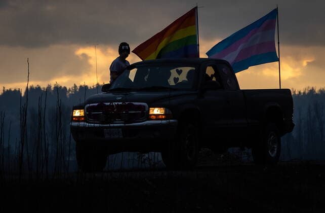 January 17, 2021, Mission, BC, Canada: A rainbow and transgender pride flag are flown on a truck participating in an anti-bullying parade of more than 1,000 vehicles in support of a transgender teenager who was allegedly assaulted outside a school, in Mission, B.C., on Sunday, January 17, 2021. According to RCMP two students were arrested and charges were recommended in regards to the incident that was recorded and posted online. Mission Canada  - ZUMAc35_ 20210117_zaf_c35_055 Copyright: xDarrylxDyckx