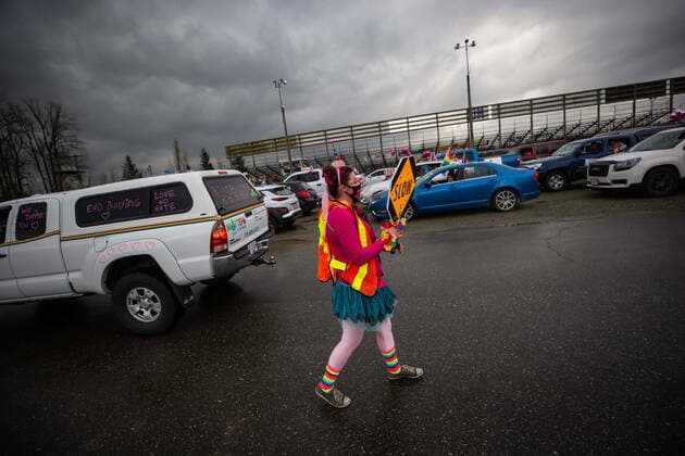 January 17, 2021, Mission, BC, Canada: A person directs traffic as people wait to participate in an anti-bullying parade of more than 1,000 vehicles in support of a transgender teenager who was allegedly assaulted outside a school, in Mission, B.C., on Sunday, January 17, 2021. According to RCMP two students were arrested and charges were recommended in regards to the incident that was recorded and posted online. Mission Canada  - ZUMAc35_ 20210117_zaf_c35_057 Copyright: xDarrylxDyckx
