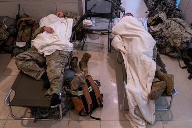 National Guard troops rest up inside the U.S. Capitol ahead of the inauguration for President-elect Joe Biden in Washington, DC on Monday, January 18, 2021. Security is even tighter given the recent events when pro-Trump MAGA mobs breached the security perimeter and penetrated the U.S. Capitol on Jan 6.  WAP20210118532 KenxCedeno
