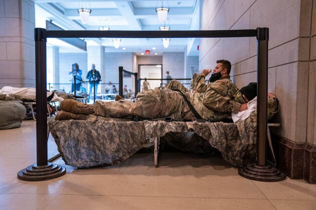 National Guard troops rest up inside the U.S. Capitol ahead of the inauguration for President-elect Joe Biden in Washington, DC on Monday, January 18, 2021. Security is even tighter given the recent events when pro-Trump MAGA mobs breached the security perimeter and penetrated the U.S. Capitol on Jan 6.  WAP20210118534 KenxCedeno
