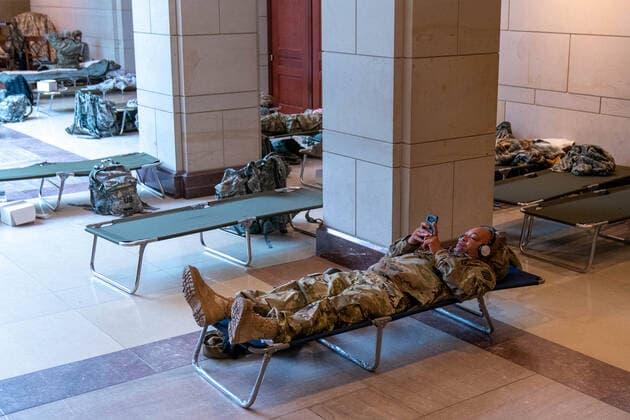 National Guard troops rest up inside the U.S. Capitol ahead of the inauguration for President-elect Joe Biden in Washington, DC on Monday, January 18, 2021. Security is even tighter given the recent events when pro-Trump MAGA mobs breached the security perimeter and penetrated the U.S. Capitol on Jan 6.  WAP20210118529 KenxCedeno