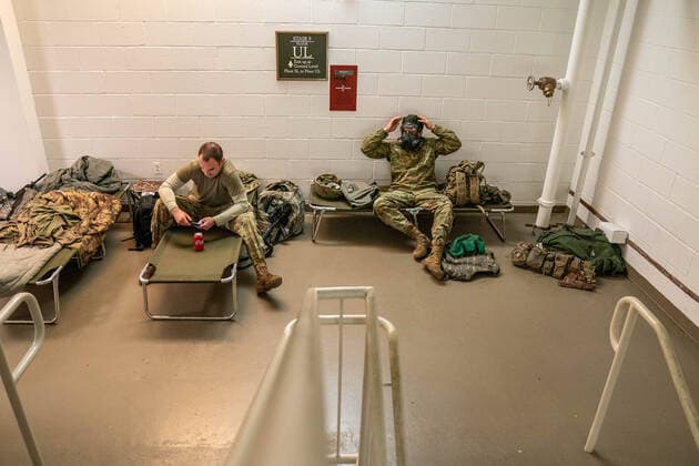 National Guard troops rest up inside the U.S. Capitol ahead of the inauguration for President-elect Joe Biden in Washington, DC on Monday, January 18, 2021. Security is even tighter given the recent events when pro-Trump MAGA mobs breached the security perimeter and penetrated the U.S. Capitol on Jan 6.  WAP20210118520 KenxCedeno