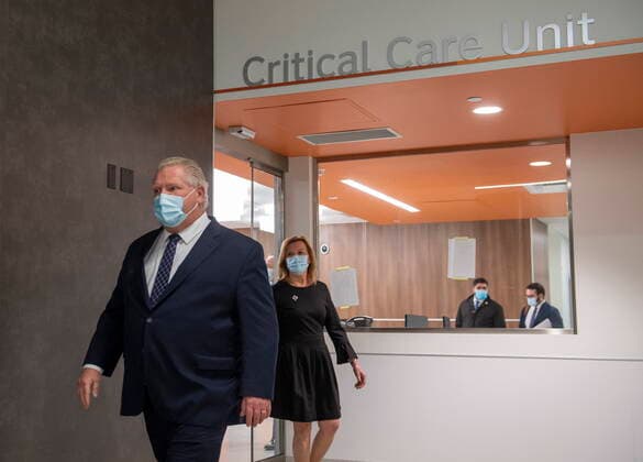 January 18, 2021, Vaughan, on, Canada: Ontario Premier Doug Ford and Health Minister Christine Elliot walk out after being given a tour of a digital Intensive Care Unit room at Cortellucci Vaughan Hospital in Vaughan, Ontario on Monday, January 18, 2021. The new hospital is being opened to take patients from other hospitals that are strained by COVID-19. Vaughan Canada  - ZUMAc35_ 20210118_zaf_c35_035 Copyright: xFrankxGunnx