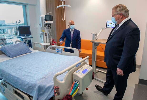 January 18, 2021, Vaughan, on, Canada: Ontario Premier Doug Ford is given a tour of a digital Intensive Care Unit room at Cortellucci Vaughan Hospital by Altaf Stationwala, President and CEO of Mackenzie Health in Vaughan, Ontario on Monday, January 18, 2021. The new hospital is being opened to take patients from other hospitals that are strained by COVID-19. Vaughan Canada  - ZUMAc35_ 20210118_zaf_c35_033 Copyright: xFrankxGunnx