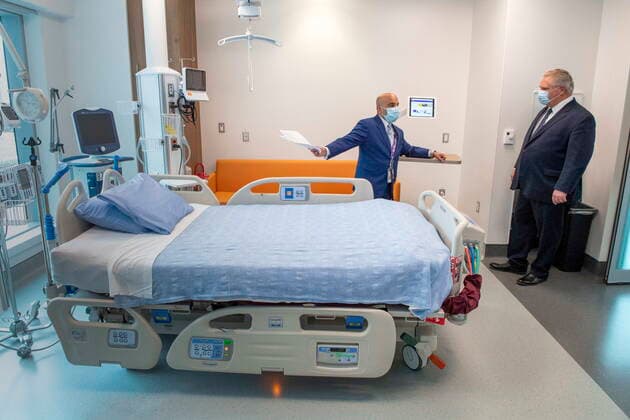 January 18, 2021, Vaughan, on, Canada: Ontario Premier Doug Ford is given a tour of a digital Intensive Care Unit room at Cortellucci Vaughan Hospital by Altaf Stationwala, President and CEO of Mackenzie Health in Vaughan, Ontario on Monday, January 18, 2021. The new hospital is being opened to take patients from other hospitals that are strained by COVID-19. Vaughan Canada  - ZUMAc35_ 20210118_zaf_c35_034 Copyright: xFrankxGunnx