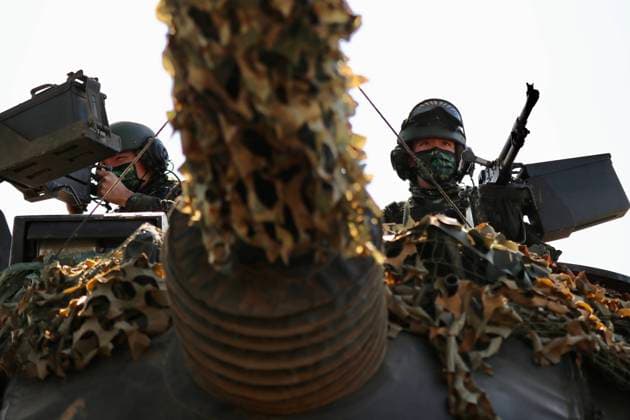 January 19, 2021, Hsinchu, Hsinchu, Taiwan: Numbers of army soldiers board a tank during the National Army Lunar New YearÃ¢â‚¬â ¢s Military Drill for Preparedness Enhancement 2021 in Taiwan. The Drill deploys armoured vehicles, tanks and military equipments including CM34, CM11, CM22, M1045, and drones for monitoring and reclaiming a building seized by terrorists under simulation as a gesture to improve national security level. Hsinchu Taiwan - ZUMAs313 20210119_zip_s313_007 Copyright: xDanielxCengxShou-Yix