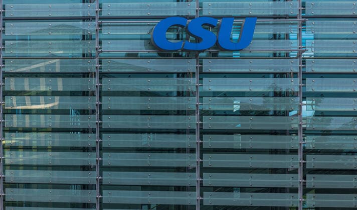 The CSU is the sister party of CDU and operates in Bavaria only. Together with the CDU they form the Christian Union. Munich, Germany - August 16, 2020: Logo at the new Headquarters of the conservative Christian Social Party - CSU in Munich, Germany