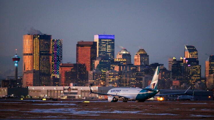 January 21, 2021, Calgary, ab, Canada: The first commercial flight of the Boeing 737 Max in Canada since the aircraft was cleared to fly again in Canadian airspace taxis in Calgary, Alta., Thursday, Jan. 21, 2021. Calgary Canada  - ZUMAc35_ 20210121_zaf_c35_003 Copyright: xJeffxMcintoshx