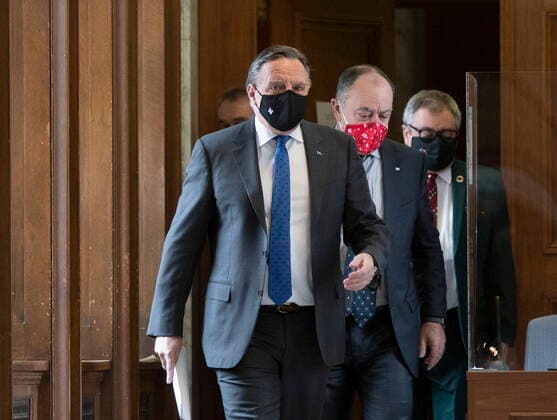 January 21, 2021, Quebec, PQ, Canada: Quebec Premier Francois Legault followed by Quebec Health Minister Christian Dube and Horacio Arruda, Quebec director of National Public Health, walk to a news conference on the COVID-19 pandemic, Thursday, January 21, 2021 at the legislature in Quebec City. Quebec Canada  - ZUMAc35_ 20210121_zaf_c35_033 Copyright: xJacquesxBoissinotx