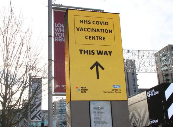 January 21, 2021, London, United Kingdom: Signage directs the public to the NHS vaccination centre..A steady stream of elderly people with pre-booked appointments at the new Covid-19 Vaccination hub at the Olympic Office Centre, near London s Wembley Stadium. .It is one of 10 new large scale Vaccination centres opened this week, to join the seven already in use across the country. So far 4.9 million people across the UK have received the first dose of vaccine and the government aims for that number to rise to 15 million by 15 February. London United Kingdom - ZUMAs197 20210121_zaa_s197_146 Copyright: xKeithxMayhewx