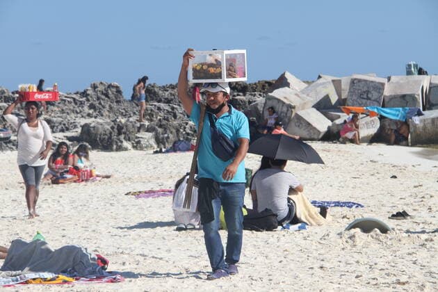 Heavy movement of people at Mandala beach amid COVID-19. (INT) Heavy movement of people at Mandala beach amid COVID-19. January 22, 2021, Cancun, Mexico: Heavy movement of people at Mandala beach amid COVID-19. With the hot weather, many people take advantage of that, flooding Mandala beach, swimming and chilling out on the shore and mostly without using masks. Good day for food vendors and street musicians who entertain beach goers for tips. Credit: Niyi Fote Thenews2. Heavy movement of people at Mandala beach amid COVID-19.  Copyright: xNiyixFotex