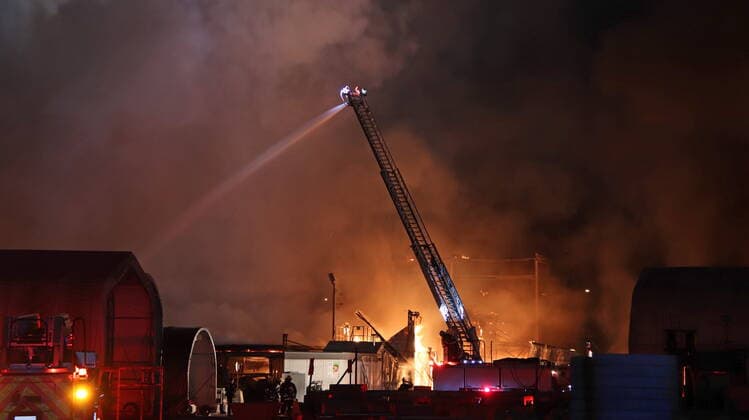 January 23, 2021, Surrey, BC, Canada: Firefighters attend the scene of a fire at AE Concrete in Surrey, B.C. early morning on Saturday Jan. 23, 2021. The three alarm was called bringing over 30 firefighters to the scene. Surrey Canada  - ZUMAc35_ 20210123_zaf_c35_015 Copyright: xShanexMackichanx