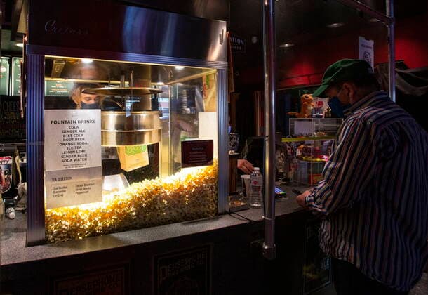 January 23, 2021, Vancouver, BC, Canada: Rio Theatre staff work to fill orders at the concession stand on the theatre s first day open as a sports bar in Vancouver, Saturday, Jan. 23, 2021. The independent movie theatre, which has been closed due to provincial public health restrictions, is now open as a sports bar. Vancouver Canada  - ZUMAc35_ 20210123_zaf_c35_059 Copyright: xMarissaxTielx