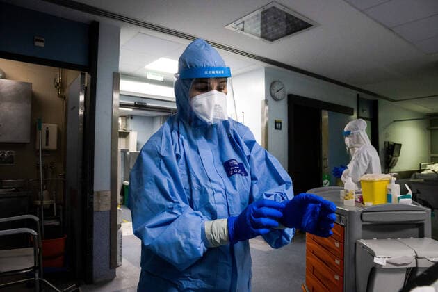 January 23, 2021, Porto, Portugal: A health worker wearing a protective suit removes gloves in a ward at the University Hospital of Sao Joao do Porto..The University Hospital of Sao Joao do Porto, a central hospital in the northern region, receives patients with Covid-19. Portugal currently has 609,136 confirmed cases, 441,556 recoveries and 9,920 death, making it the worst country in the world with the most new cases per million inhabitants. Porto Portugal - ZUMAs197 20210123_zaa_s197_234 Copyright: xRitaxFranÃAx