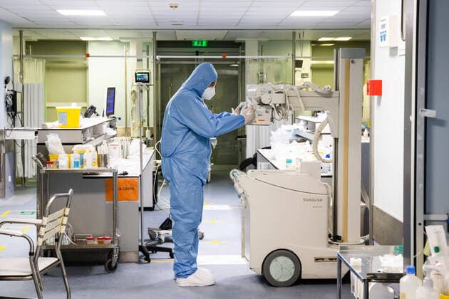 January 23, 2021, Porto, Portugal: A health worker wearing a protective suit seen checking an x-ray machine at the University Hospital of Sao Joao do Porto..The University Hospital of Sao Joao do Porto, a central hospital in the northern region, receives patients with Covid-19. Portugal currently has 609,136 confirmed cases, 441,556 recoveries and 9,920 death, making it the worst country in the world with the most new cases per million inhabitants. Porto Portugal - ZUMAs197 20210123_zaa_s197_245 Copyright: xRitaxFranÃAx