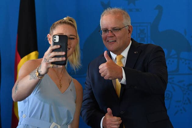 2021 AUSTRALIAN OF THE YEAR MORNING TEA, Victoria?s 2021 Young Australian of the Year finalist Tayla Harris and Prime Minister Scott Morrison do a phone message during an Australian of the Year morning tea at Parliament House in Canberra, Monday, January 25, 2021. ( NO ARCHIVING, EDITORIAL USE ONLY, NO USE IN BOOKS WITHOUT CONSENT CANBERRA ACT AUSTRALIA  Copyright: xMICKxTSIKASx 20210125001515939943