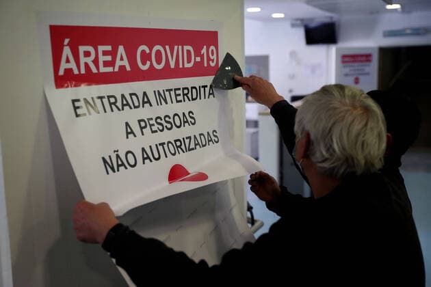 January 26, 2021, Lisbon, Portugal: Military personnel put up a sign on a door of a new COVID-19 ward being set up at the Military Hospital in Lisbon, Portugal on January 26, 2021. The Military Hospital is expanding it s number of beds available to take COVID-19 patients from the National Health Service, when Portugal on Tuesday saw another 291 deaths associated with Covid-19 in the previous 24 hours, the highest daily figure since the start of the pandemic, and 10,765 new confirmed cases of infection. Lisbon Portugal - ZUMAf123 20210126_zap_f123_001 Copyright: xPedroxFiuzax