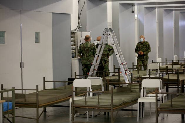 January 26, 2021, Lisbon, Portugal: Soldiers prepare a new COVID-19 ward being set up at the Military Hospital in Lisbon, Portugal on January 26, 2021. The Military Hospital is expanding it s number of beds available to take COVID-19 patients from the National Health Service, when Portugal on Tuesday saw another 291 deaths associated with Covid-19 in the previous 24 hours, the highest daily figure since the start of the pandemic, and 10,765 new confirmed cases of infection. Lisbon Portugal - ZUMAf123 20210126_zap_f123_017 Copyright: xPedroxFiuzax