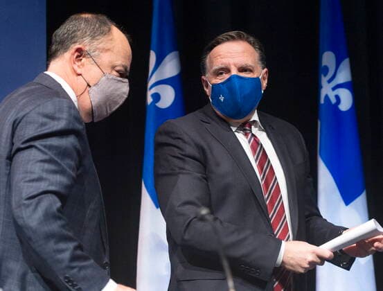 January 26, 2021, Montreal, PQ, Canada: Quebec Premier Francois Legault, right, has a word with Health Minister Christian Dube as the leave the COVID-19 press briefing, Tuesday, January 26, 2021 in Montreal. Montreal Canada  - ZUMAc35_ 20210126_zaf_c35_030 Copyright: xRyanxRemiorzx