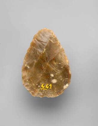 Biface, Acheulean, 700,000 200,000 B.C., Acheulean, Flint, H. 4 11 16 in. (11.9 cm); W. 3 5 16 in. (8.5 cm); D. 1 in. (2.5 cm); Wt. 10 oz. (290 g), Tools  Copyright Artokoloro LC200124_32963