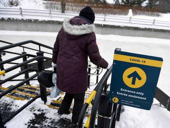 January 28, 2021, Ottawa, on, Canada: A person follows directions for one-way traffic on a staircase as they arrive to skate on the Rideau Canal Skateway on its opening day in Ottawa, on Thursday, Jan. 28, 2021, in the midst of the COVID-19 pandemic. The Rideau Canal is a UNESCO World Heritage Site. Ottawa Canada  - ZUMAc35_ 20210128_zaf_c35_004 Copyright: xJustinxTangx