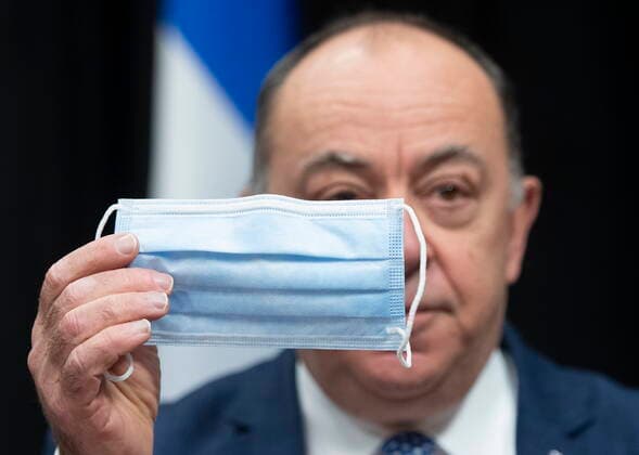 January 28, 2021, Quebec, PQ, Canada: Quebec Health Minister Christian Dube holds a procedural mask, one of the many they ordered from a Quebec company, during a news conference on the COVID-19 pandemic, Thursday, January 28, 2021 at the legislature in Quebec City. Quebec Canada  - ZUMAc35_ 20210128_zaf_c35_033 Copyright: xJacquesxBoissinotx