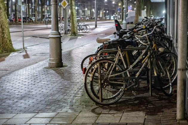 January 28, 2021, Amsterdam, Netherlands: Parked bicycles seen on an empty street in Amsterdam as strict curfew was imposed by the Dutch government to prevent and combat the spread of COVID virus..Police were deployed on the streets of Amsterdam for the night-time curfew that is applied from 21:00 local time until 04:30. The new Covid-19 mutation helps the infection number rise. The Dutch police is checking citizens for proper documents, permit from employers in order to be out after the curfew time. Most of the roads are empty after 21:00, deserted while public transportation vehicles are empty. The Netherlands faced some violent protests the previous days against the strict lockdown measures. Amsterdam Netherlands - ZUMAs197 20210128_zaa_s197_211 Copyright: xNikxOikox