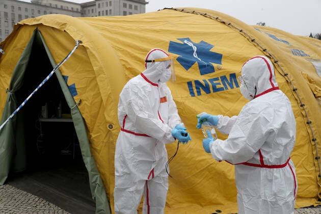 January 29, 2021, Lisbon, Portugal: Health workers wearing protective suits disinfect themselves outside a support tent in the new triage center for Covid-19 at Santa Maria Hospital, which opened today to help in the reception of patients in Lisbon, Portugal, on January 29, 2021. Portugal is reporting new daily records of COVID-19 deaths and hospitalizations as a recent pandemic surge continues unabated. Lisbon Portugal - ZUMAf123 20210129_zap_f123_008 Copyright: xPedroxFiuzax