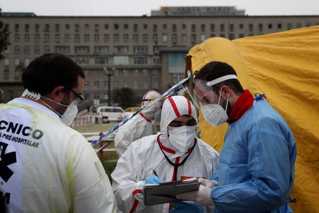 January 29, 2021, Lisbon, Portugal: Health workers wearing protective suits check data in the new triage center for Covid-19 at Santa Maria Hospital, which opened today to help in the reception of patients in Lisbon, Portugal, on January 29, 2021. Portugal is reporting new daily records of COVID-19 deaths and hospitalizations as a recent pandemic surge continues unabated. Lisbon Portugal - ZUMAf123 20210129_zap_f123_012 Copyright: xPedroxFiuzax