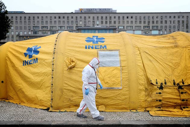 January 29, 2021, Lisbon, Portugal: A health worker wearing a protective suit walks past by a support tent in the new triage center for Covid-19 at Santa Maria Hospital, which opened today to help in the reception of patients in Lisbon, Portugal, on January 29, 2021. Portugal is reporting new daily records of COVID-19 deaths and hospitalizations as a recent pandemic surge continues unabated. Lisbon Portugal - ZUMAf123 20210129_zap_f123_013 Copyright: xPedroxFiuzax