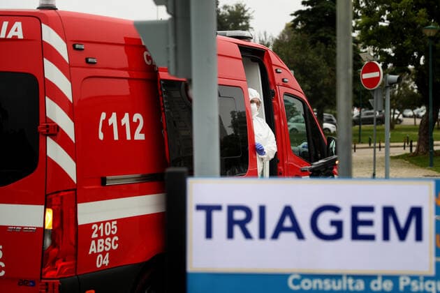 January 29, 2021, Lisbon, Portugal: A Health worker wearing a protective suit looks out of an ambulance in the new triage center for Covid-19 at Santa Maria Hospital, which opened today to help in the reception of patients in Lisbon, Portugal, on January 29, 2021. Portugal is reporting new daily records of COVID-19 deaths and hospitalizations as a recent pandemic surge continues unabated. Lisbon Portugal - ZUMAf123 20210129_zap_f123_014 Copyright: xPedroxFiuzax