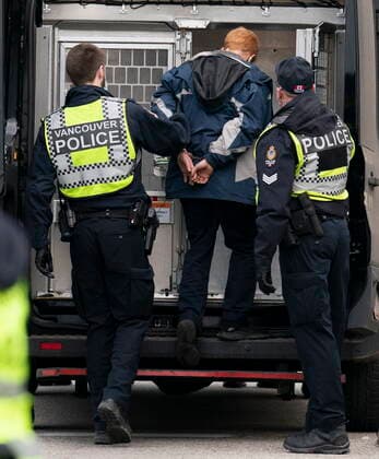January 29, 2021, Vancouver, BC, Canada: Members of the Extinction Rebellion get arrested after blocking the entrance to the Port of Vancouver, Friday, January 29, 2021. The protesters planned the march and blockade as a part of their anti-pipeline campaign. Vancouver Canada  - ZUMAc35_ 20210129_zaf_c35_068 Copyright: xJonathanxHaywardx