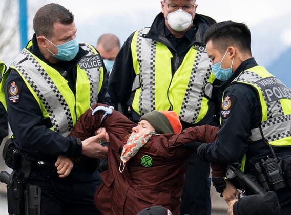 January 29, 2021, Vancouver, BC, Canada: Members of the Extinction Rebellion get arrested after blocking the entrance to the Port of Vancouver, Friday, January 29, 2021. The protesters planned the march and blockade as a part of their anti-pipeline campaign. Vancouver Canada  - ZUMAc35_ 20210129_zaf_c35_075 Copyright: xJonathanxHaywardx