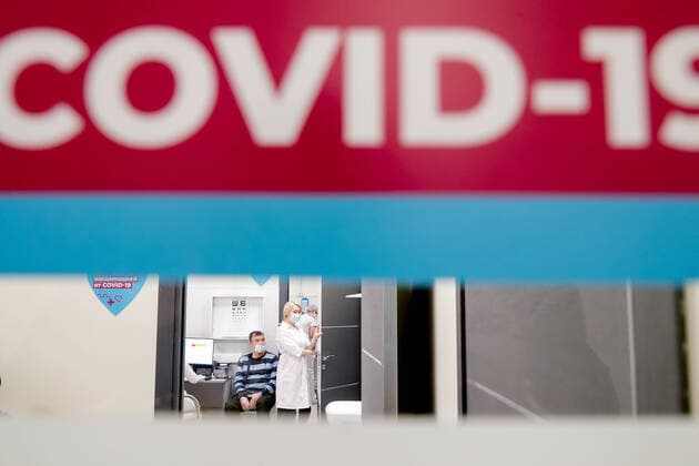 MOSCOW, RUSSIA - FEBRUARY 3, 2021: Vaccination with the Gam-COVID-Vak (Sputnik V) vaccine against COVID-19 at a mobile vaccination point at the Columbus shopping mall. Mikhail Japaridze TASS  TS0F5D6C
