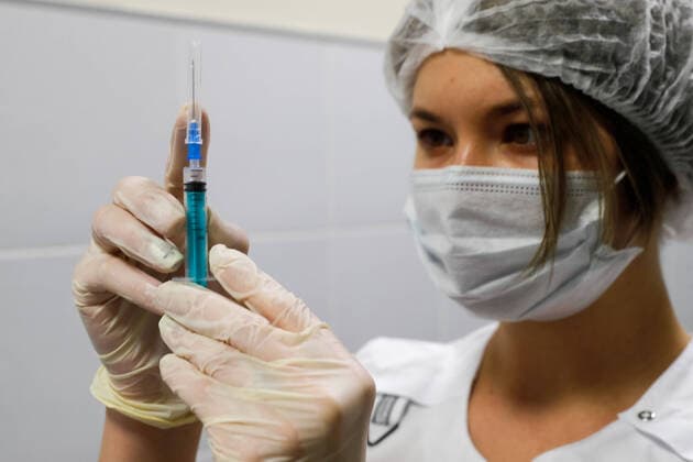 MOSCOW, RUSSIA - FEBRUARY 3, 2021: A medical worker prepares a syringe during vaccination with the Gam-COVID-Vak (Sputnik V) vaccine against COVID-19 at a mobile vaccination point at the Columbus shopping mall. Mikhail Japaridze TASS  TS0F5D70