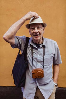 Portrait of smiling senior man against wall Sweden, Stockholm, model released Copyright: xMaskotx , MA84276