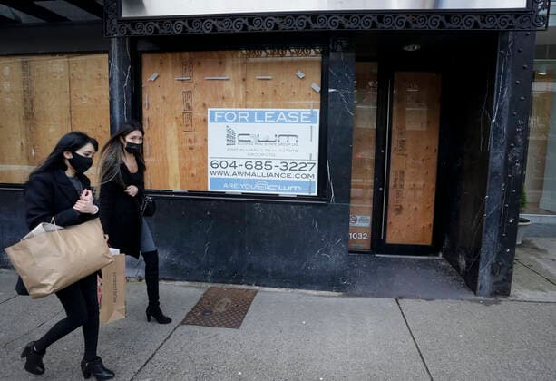(210205) -- VANCOUVER, Feb. 5, 2021 -- People wearing face masks walk past space for lease in downtown Vancouver, British Columbia, Canada, on Feb. 5, 2021. The unemployment rate in Canada rose by 0.6 percentage point to 9.4 percent in January, the highest rate since August 2020, said official Statistics Canada on Friday. (Photo by Xinhua) CANADA-VANCOUVER-UNEMPLOYMENT RATE-RISING LiangxSen 